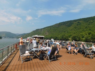 People on deck enjoying beautiful scenery.
