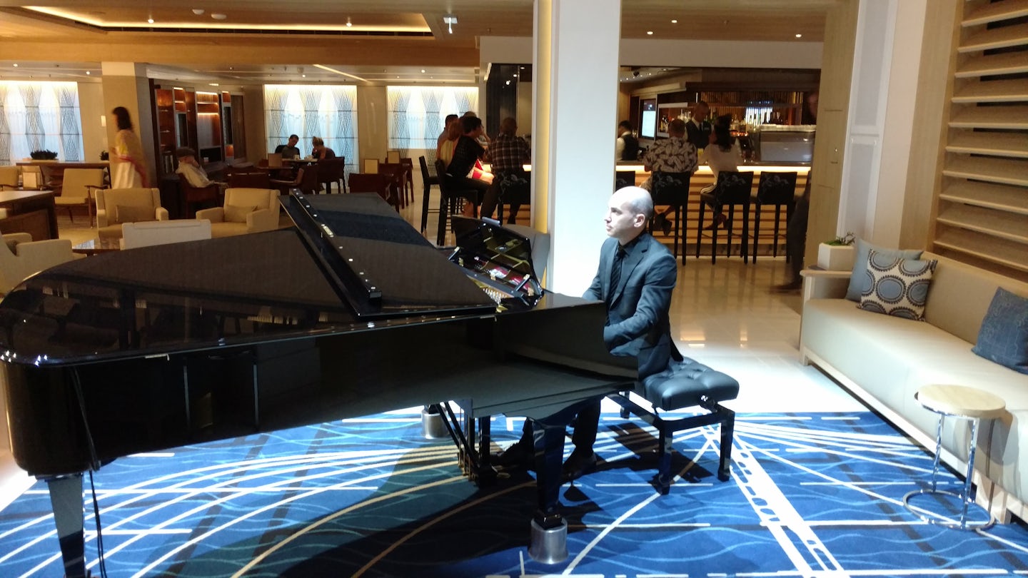 Pianist playing in atrium.