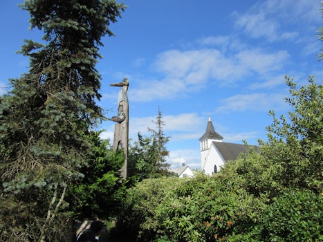 Totem Pole and church. The Chief Kyan Totem Pole at Whale Park. There's