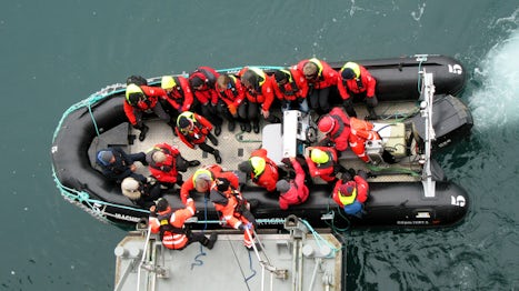 The RIB pit crew are tethered to the ship as they help passengers on and off the RIBs. Even the less agile passengers were assisted in mastering the awkward manoeuvre.
