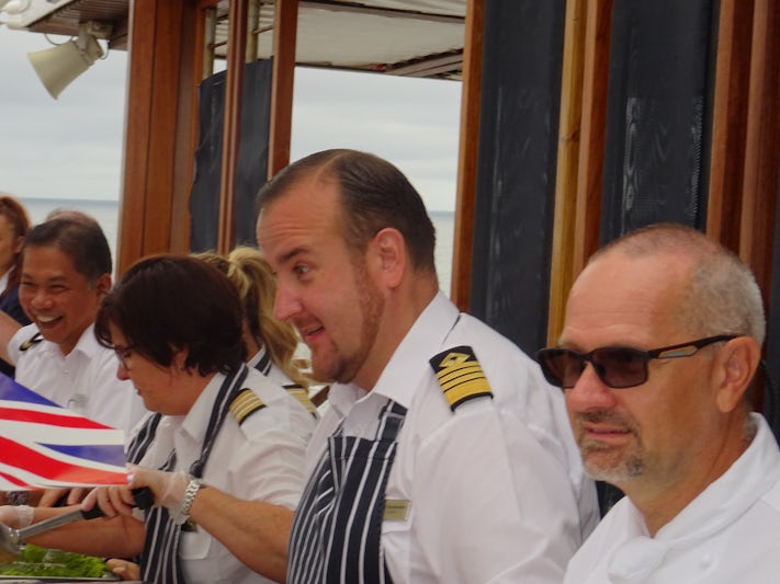 The Captain and officers serving fish & chips