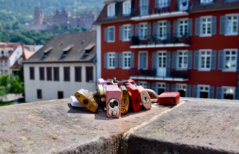 Love locks on the bridge in Heidelberg, with the castle in the background.