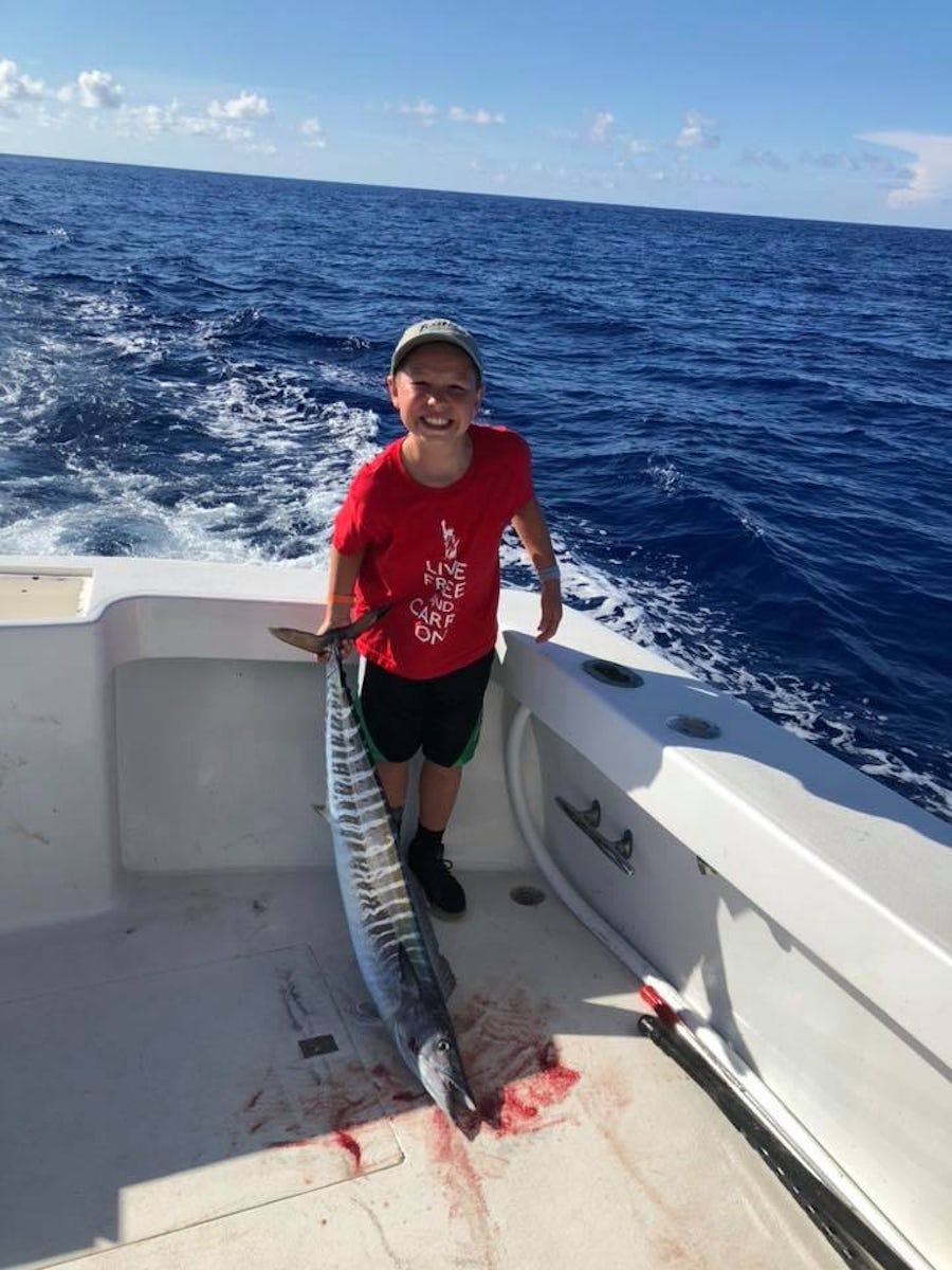 Fishing Charter.  My son reeled in that huge Wahoo.