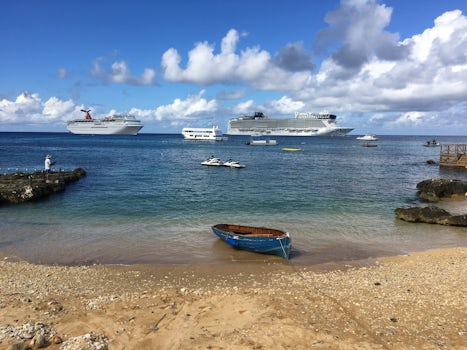Norwegian Epic and a Carnival cruise ship anchored at Grand Cayman, Cayman