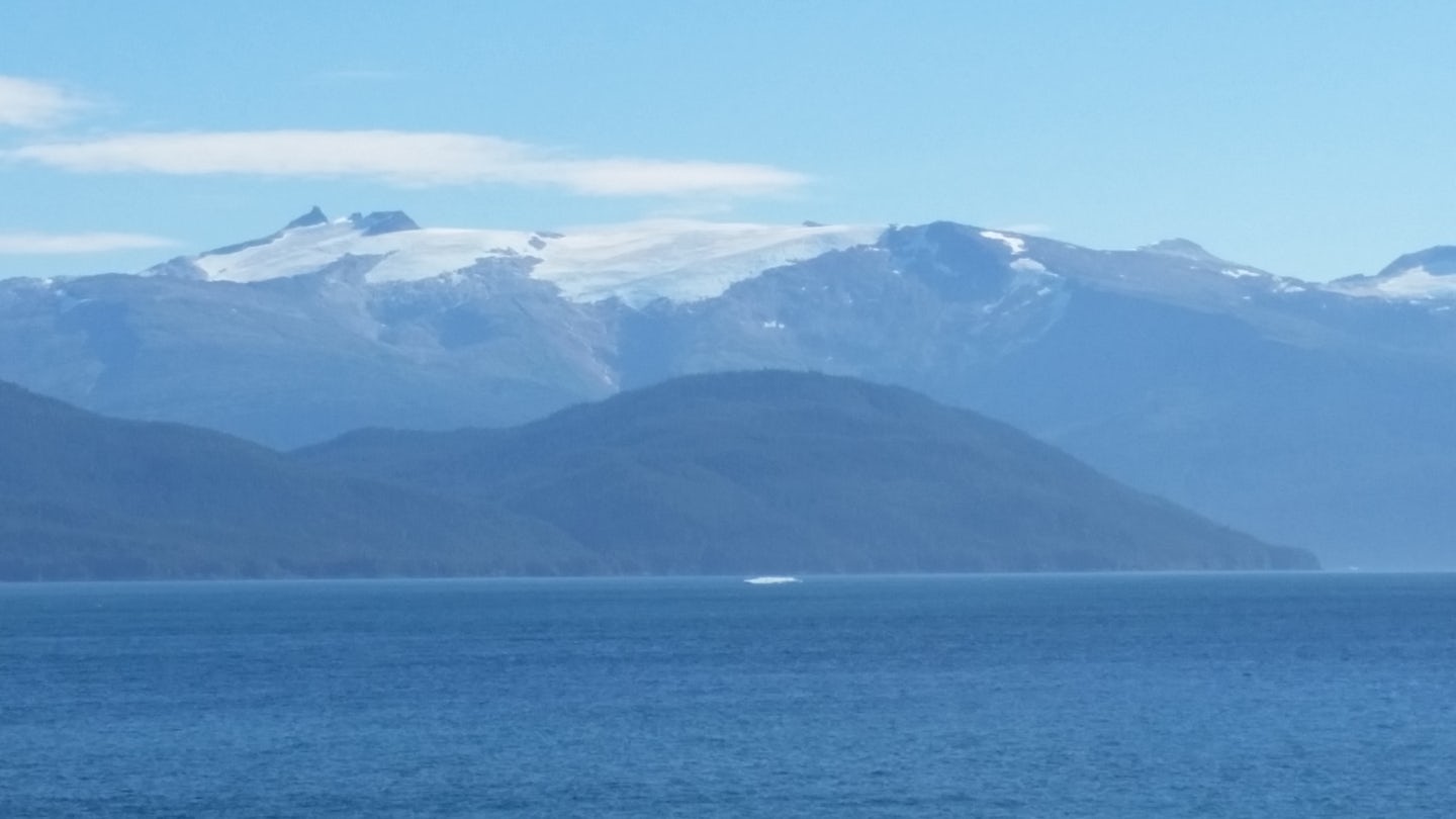 On the way to Juneau.  The chunk of ice in the water is a small iceberg.