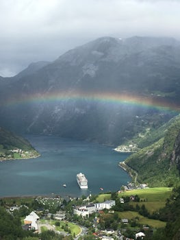 Geiranger, Norway from the mountain looking down at our ship with a rainbow
