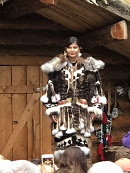 A native young lady displayed her beautiful traditional Eskimo coat.