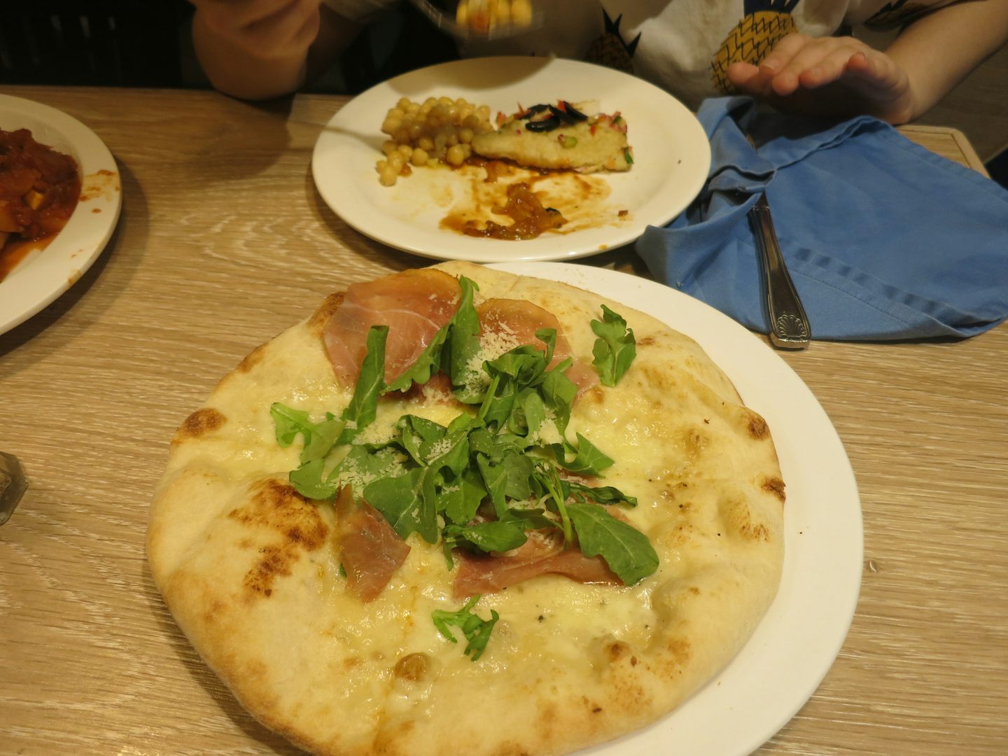 Pizza with prosciutto and arugola
