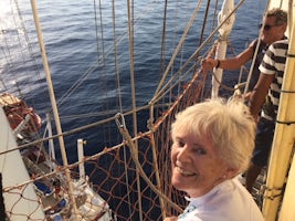 Author having climbed rigging with deck below