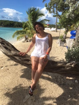 My wife posing at a tree in Blue Lagoon, Nassau. We loved the little beach.