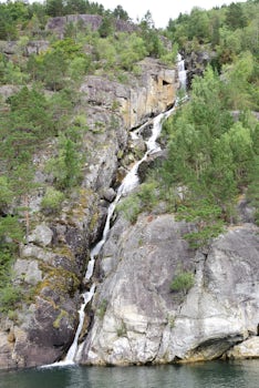 View of waterfall during scenic cruising