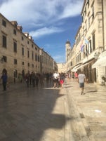 Dubrovnik main thoroughfare on a busy morning. Irish bars on the LHS street