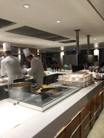 Excellent chef staff preparing a la carte in the main dining room.