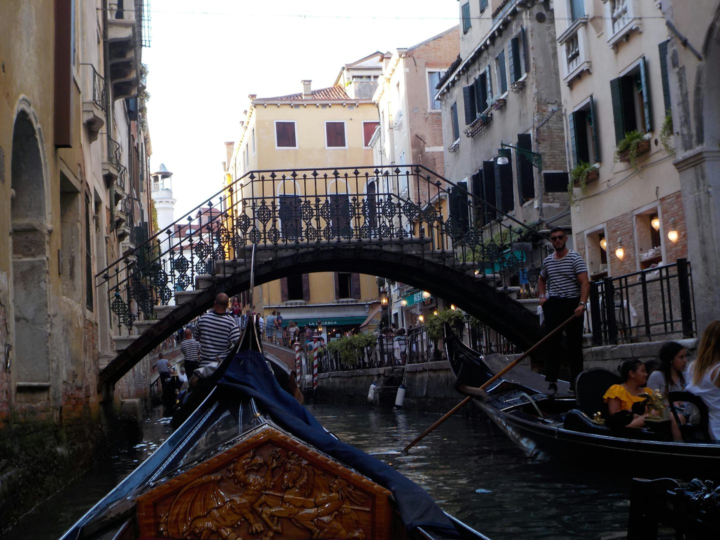 Singing along with the accordions in other gondolas in Venice.