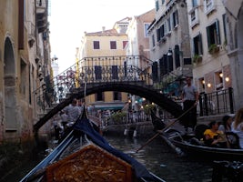 Singing along with the accordions in other gondolas in Venice.