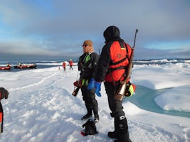On an ice flow somewhere in the Canadian arctic. The rifle is a precaution