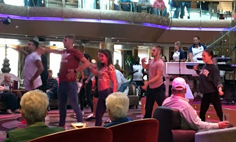 Line dancing by the ship dancers on Embarkation day