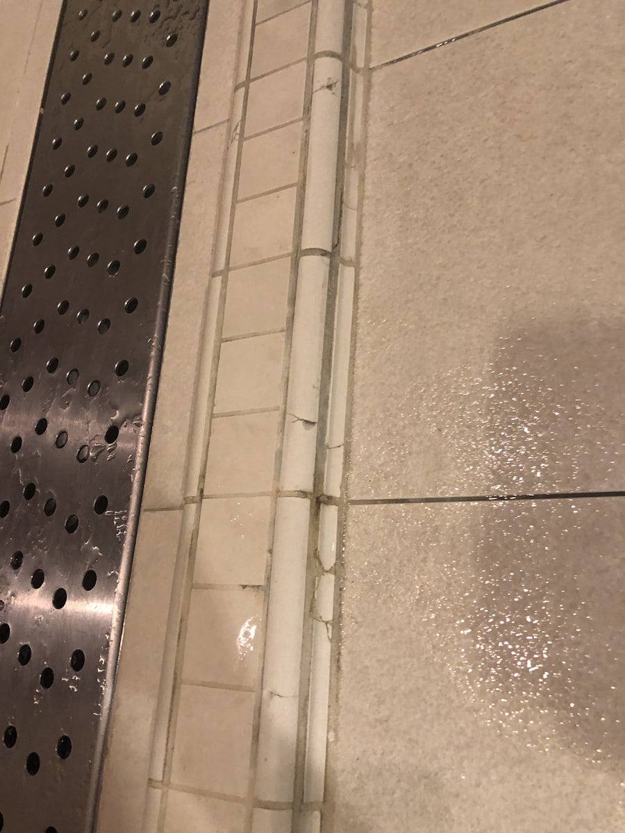 Cracked and sharp tiles in spa bathroom