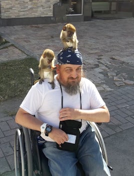 In St. Kitts, men walking around with monkeys let you take pictures for mon