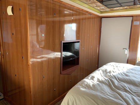 Bedroom TV and door to the deck for Suite 10506
