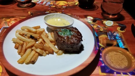 Le Petit Chef  - Actual Steak and Frites dinner.  To the right is the "