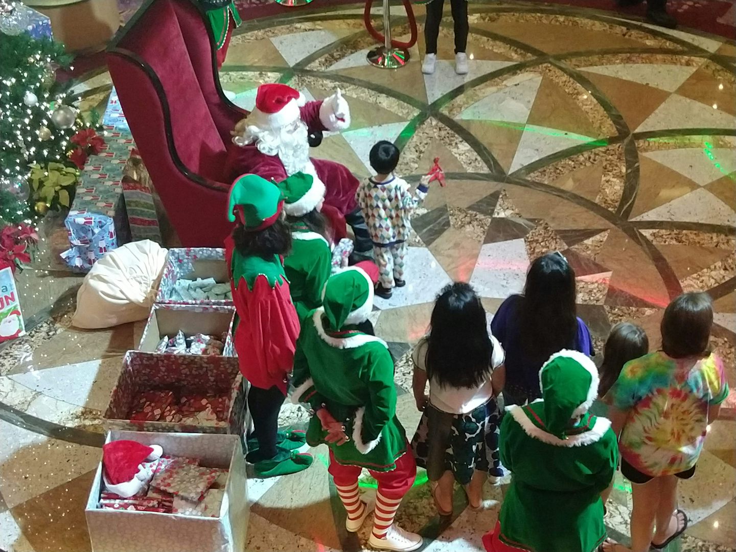 Santa and his elves gave presents to all the children