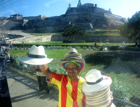 Cartagena old city tour. Hat vendor at the fort. There is high unemployment