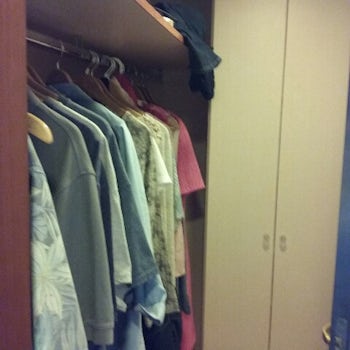 Open closet as well as closed closet. Ample storage space in stateroom (bet