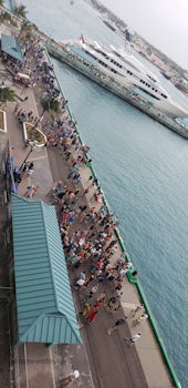 The throngs and throng of people exiting the ship.