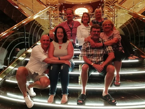 Us and friends sitting on the lit up steps on Deck 5.