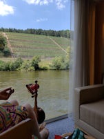 Spinning yarn while cruising down the river. Vineyards on the slope. German