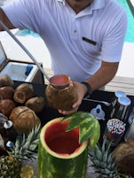 Tropical drinks served dramatically by the pool