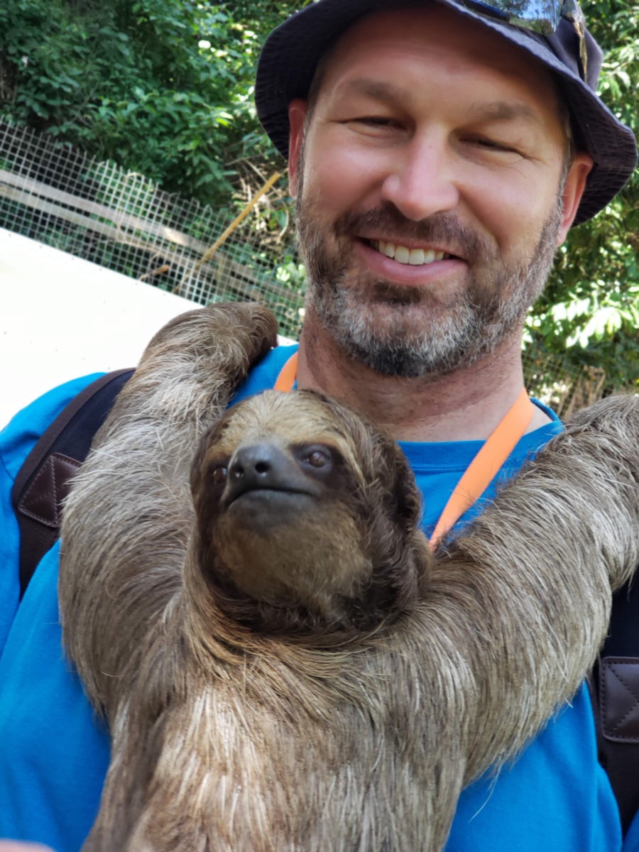 Holding a sloth named Betty.