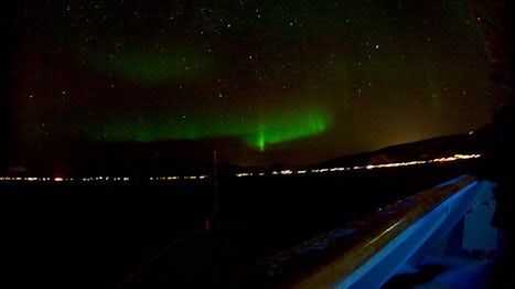 Northern lights watched from the bow of the ship