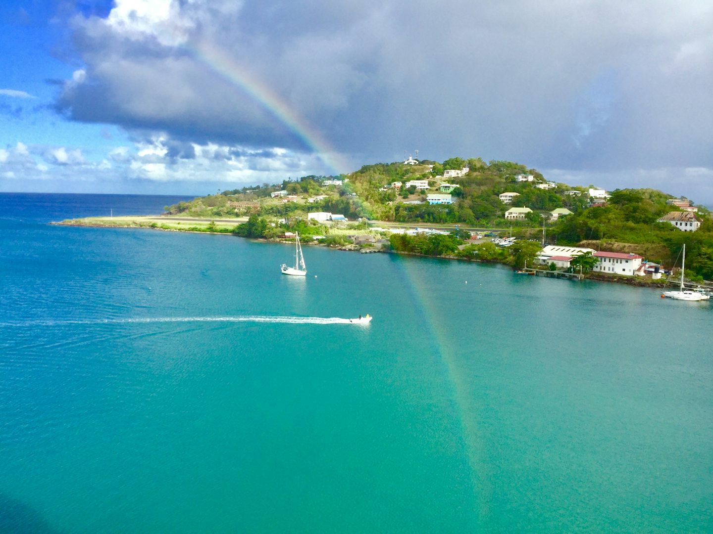 St Lucia harbor from our balcony. A rainbow appeared from the water over th