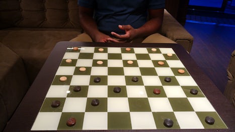 Playing checkers.