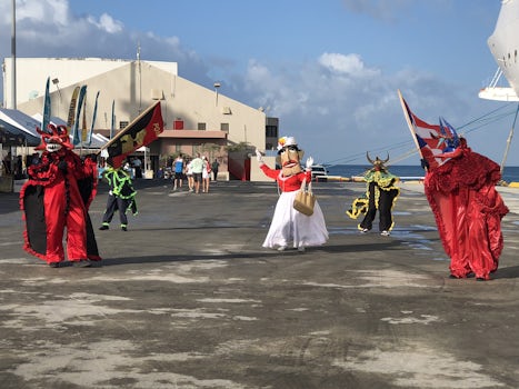 Being greeted by Carnival costumed dancers in Ponce, Puerto Rico