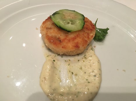See the cucumber slice?  The &#34;shrimp and crab&#34; cake was not much bi