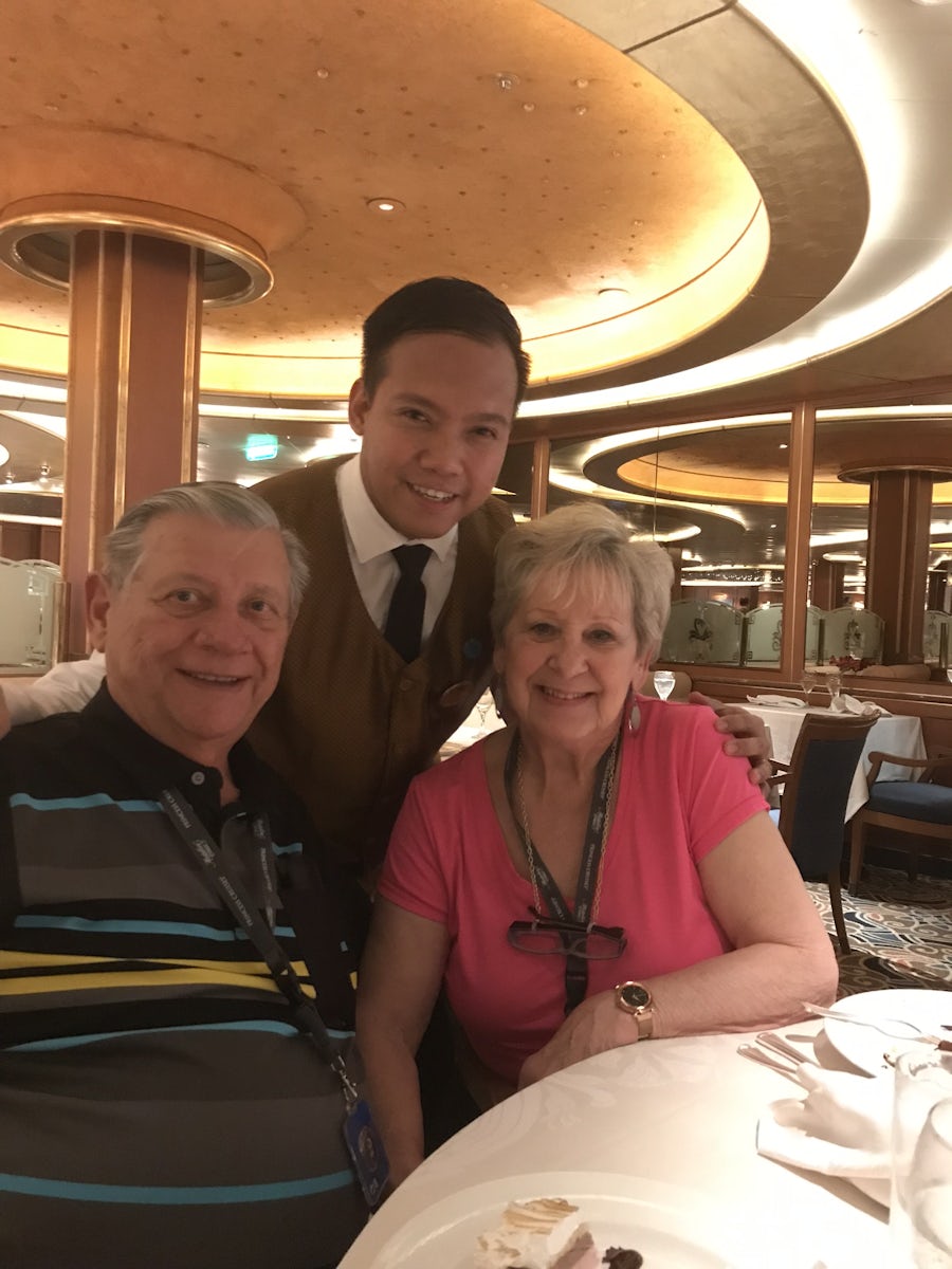 Us in the dining room with our waiter last night of cruise