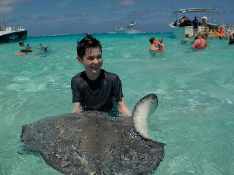 Holding a stingray at Stingray City in Grand Cayman