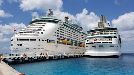 Adventure of the Seas docked next to Rhapsody of the Seas in Cozumel