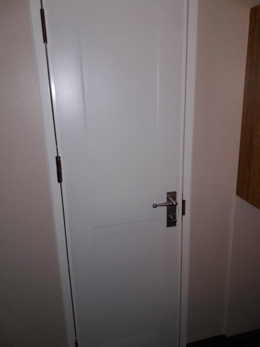 Door connecting to the one bedroom with 6 people in it who did not know ins