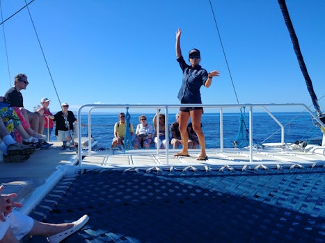 Captain Emily on the whale watching catamaran in Maui giving us a safety br
