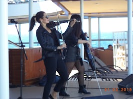 The Lighthouse String Duo performing poolside