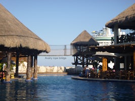 Pool in Costa Maya with aviary bridge in the background.