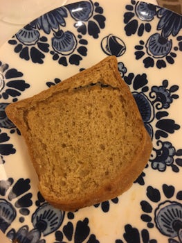 Not appetizing gluten-free bread slice shown as served