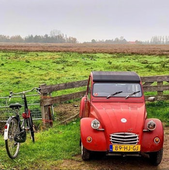 A bicycle and a Deux Chevaux in Holland at Zaanse Schans.  