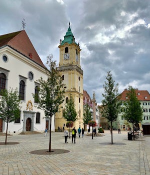 The yellow tower is part of the Old Town Hall in Bratislava, Slovakia. 