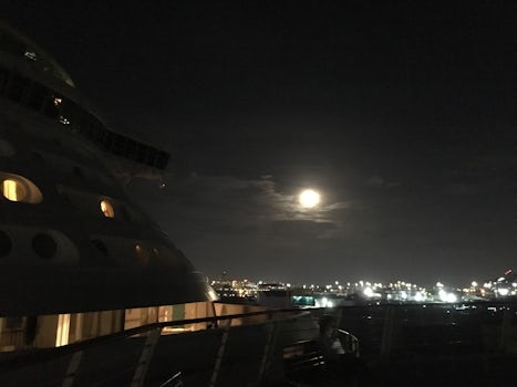 Ship pulling out of San Juan 8pm -- fort and full moon