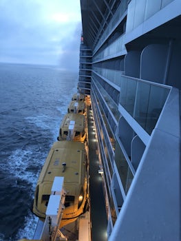 The balcony view of the side of the ship facing the back.